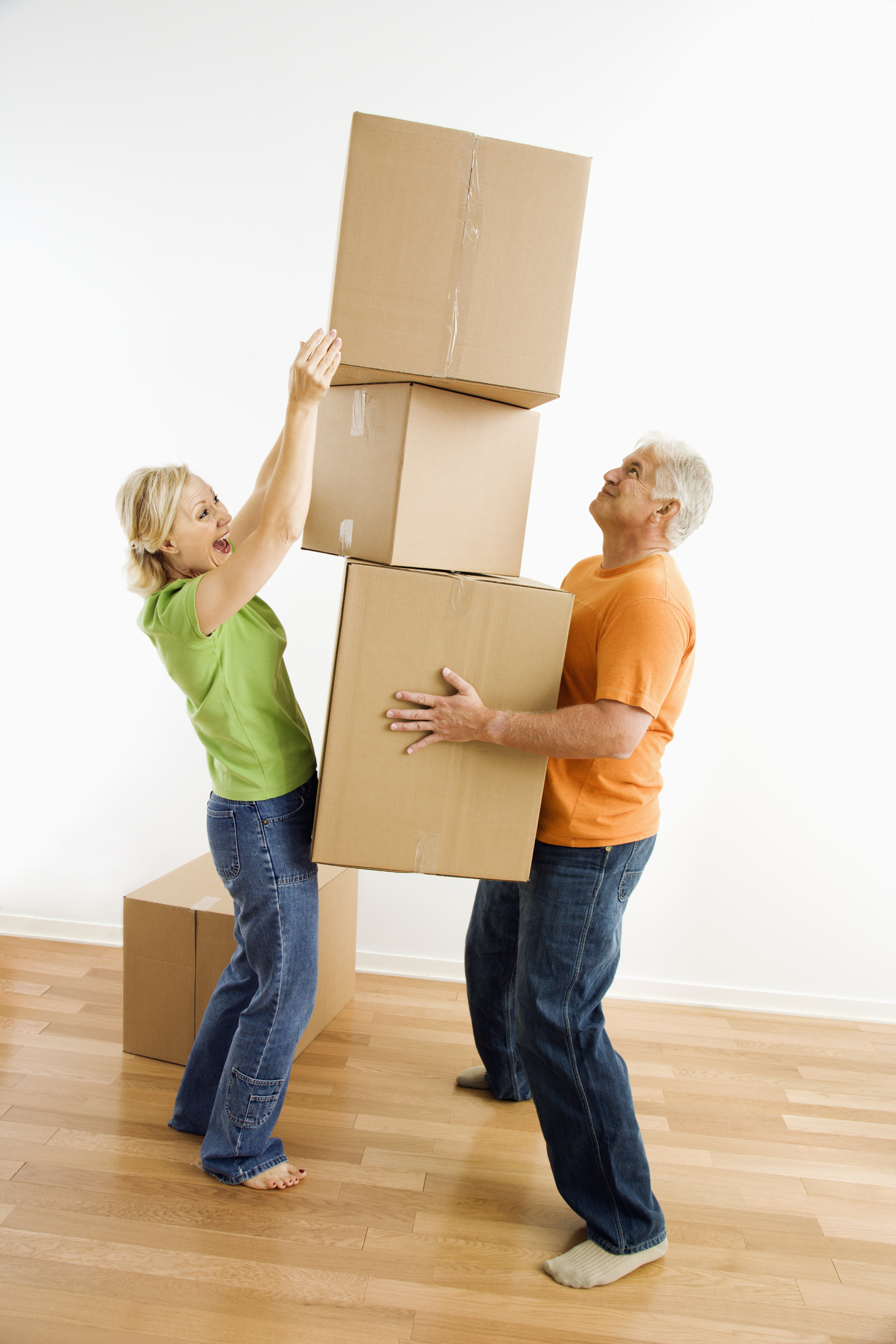 Woman stacking boxes.